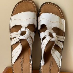 Women’s white sandals.